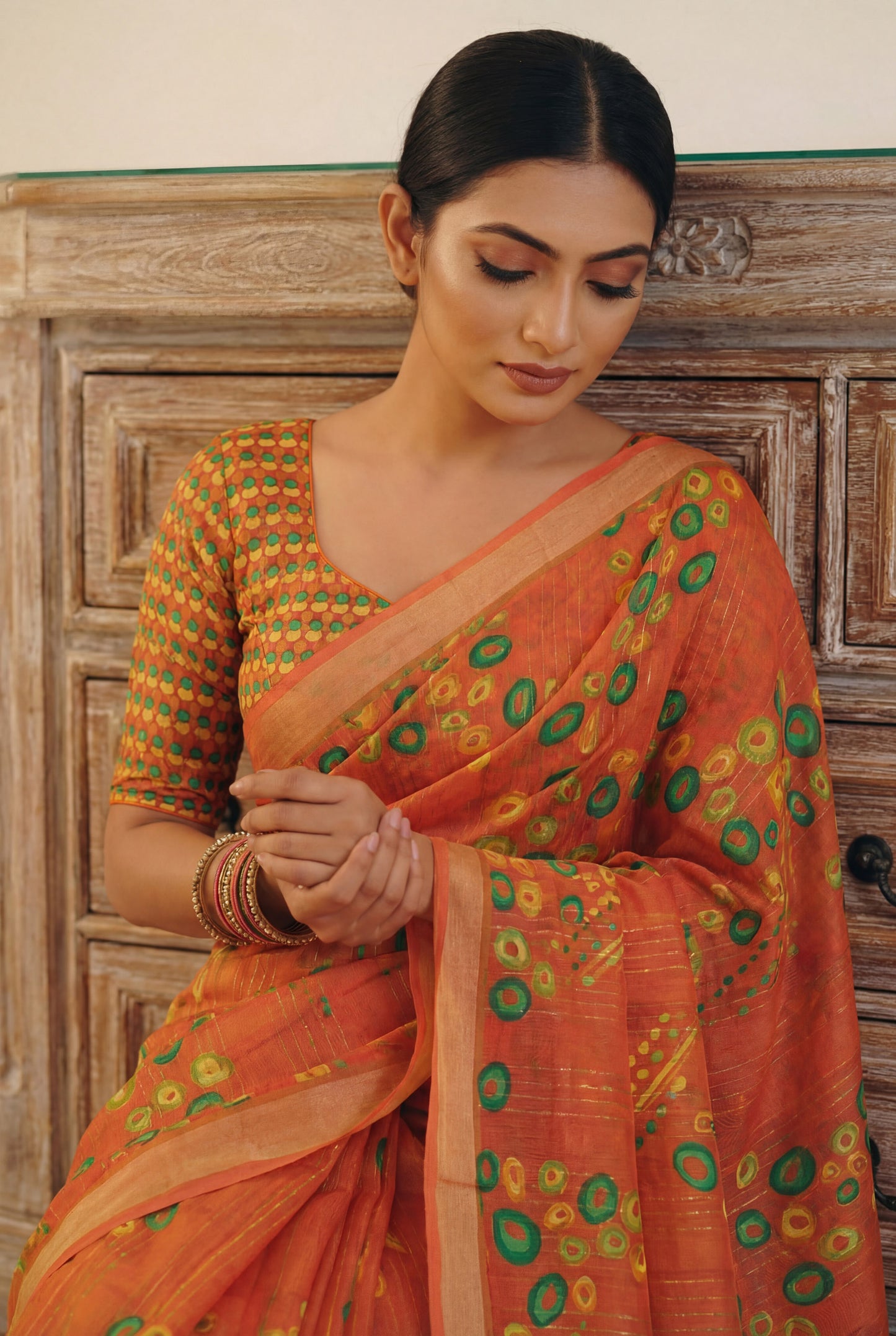 Urvashi - Orange Chiffon Printed Saree with Lace Border
